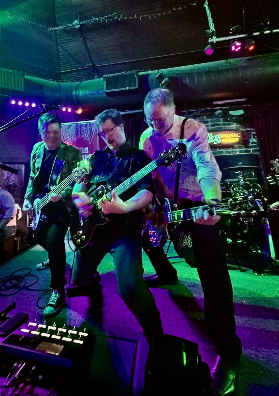 Larceny guitarists Dan, Kevin, and Tim jamming together at Sky Music Lounge