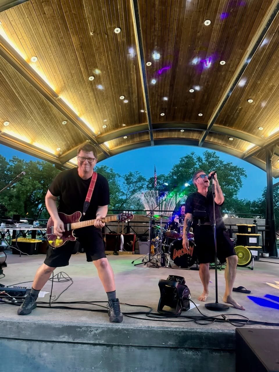 Larceny performing live at Highland under stage lights