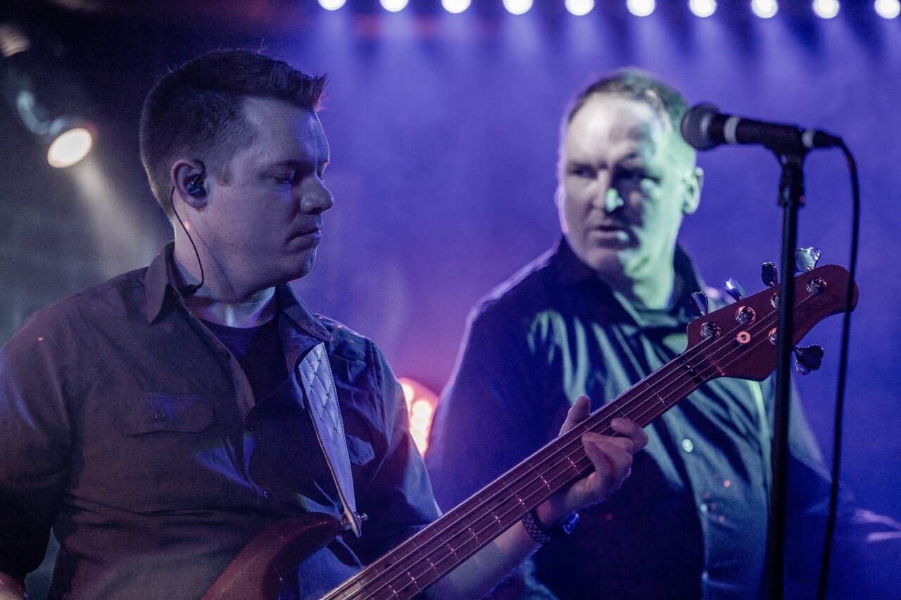 Larceny bassist Tim and guitarist Dan performing close-up at Sky Music Lounge
