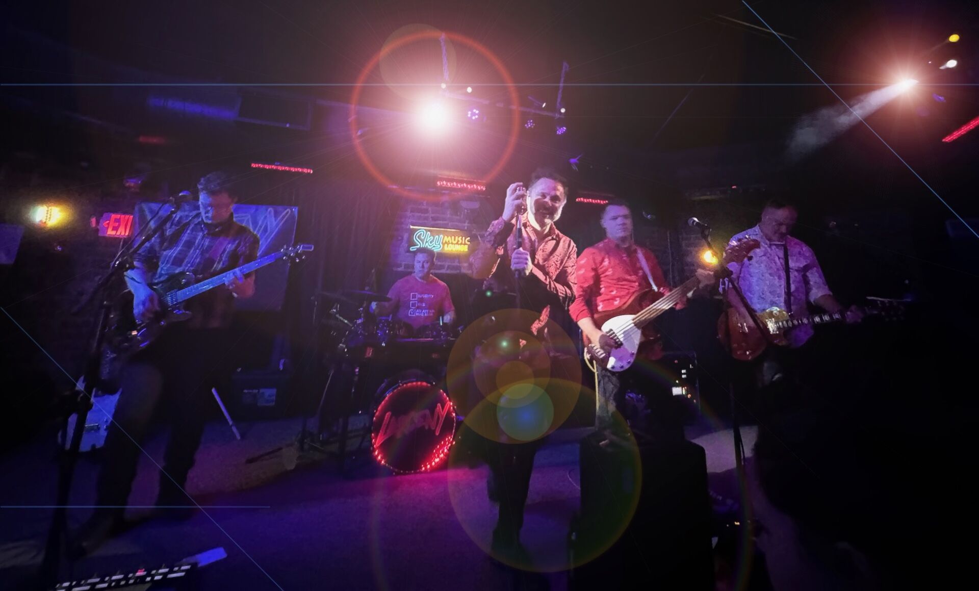 Larceny performing with dramatic stage lights