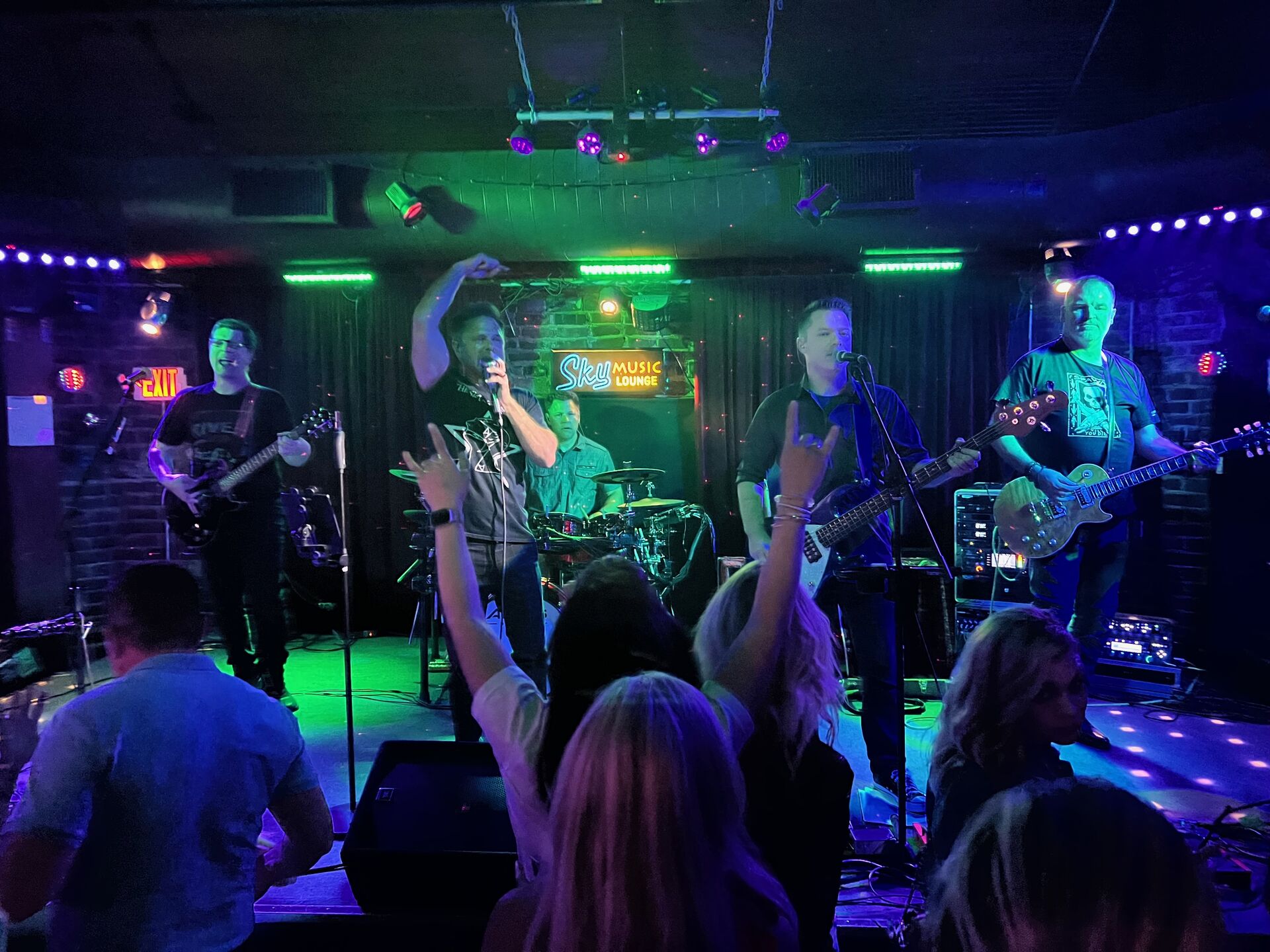 Larceny rocking out with crowd at Sky Music Lounge
