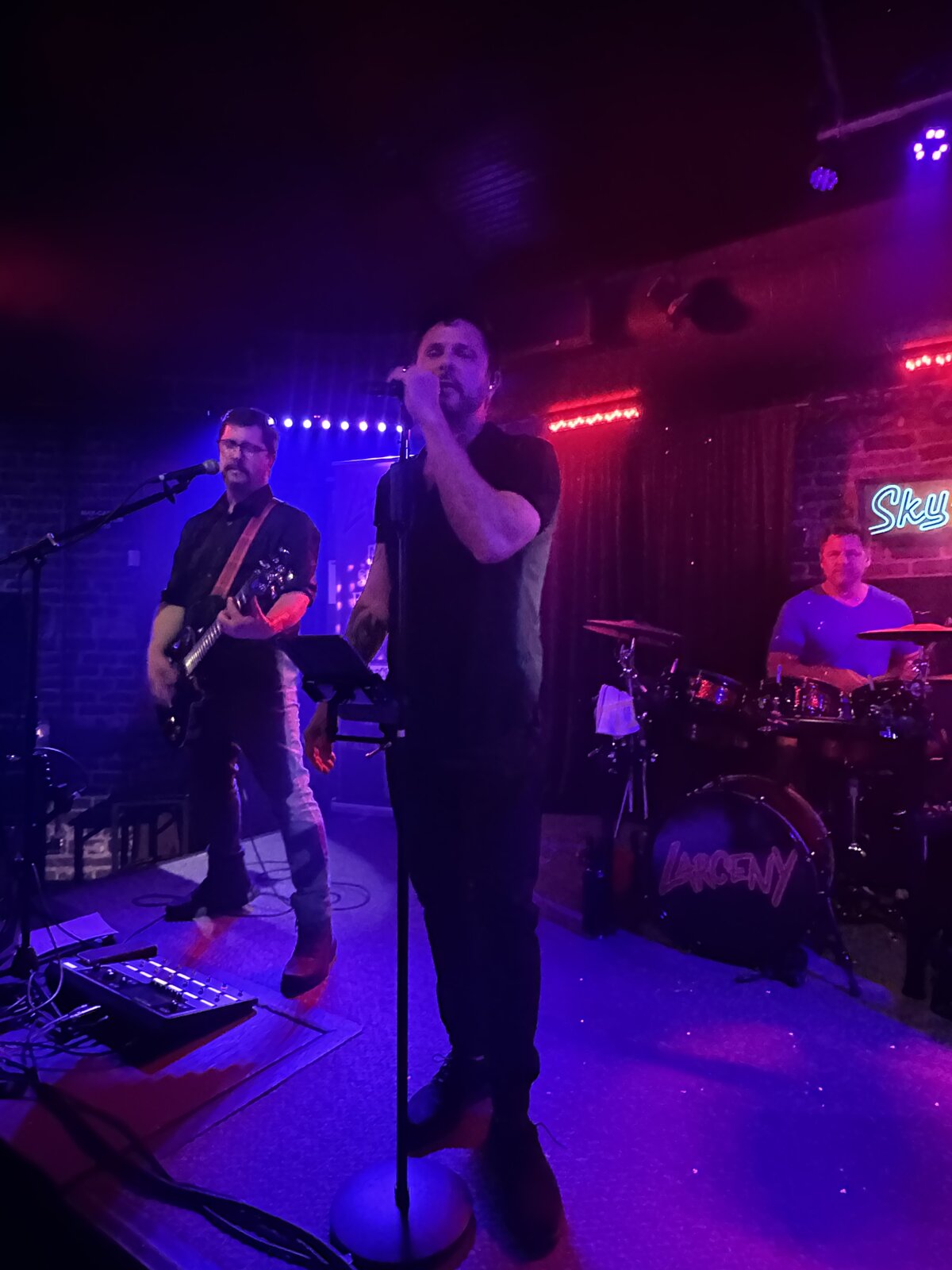 Erik Wilson on vocals with Dan on guitar and John on drums at Sky Music Lounge