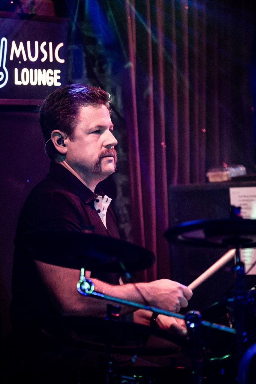 John Ebersohl focused on drums with in-ear monitors at Sky Music Lounge